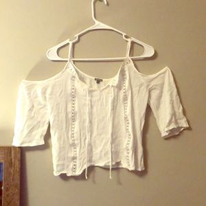 White blouse with open shoulders.